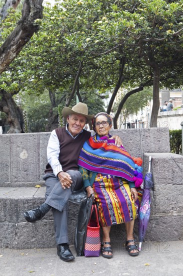 Elderly Guatemalan couple in traditional clothing, Parque Centroamérica or Parque Central, Quetzaltenango or Xela, Quetzaltenango Province, Guatemala