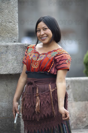 Mayan woman of the K'iché people in traditional dress, portrait, Parque Centroamérica or Parque Central, Quetzaltenango or Xela, Quetzaltenango Province, Guatemala