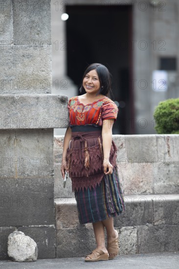 Mayan woman from the K'iché people in traditional dress, Parque Centroamérica or Parque Central, Quetzaltenango or Xela, Quetzaltenango Province, Guatemala