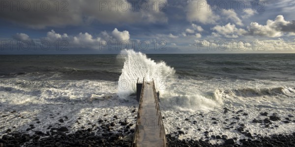 Pier during storm, bridge with waves, Atlantic Ocean, Madeira, Portugal