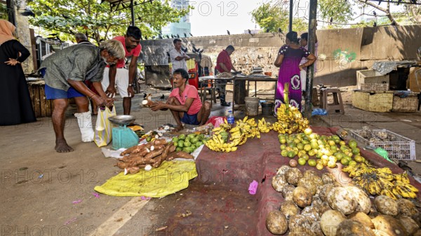 Lively open-air market with tropical fruit and vegetable shops