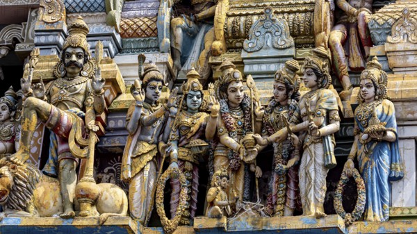 Detailed Hindu sculptures on a temple, richly decorated
