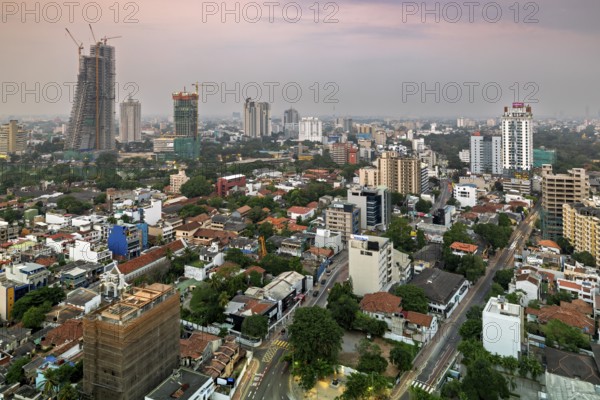 Urban scene at dusk with high-rise buildings and quiet surroundings, The skyline of Colombo in Sri Lanka