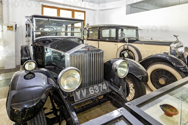 Black classic cars in a museum room, polished look, early automotive history design, classic car in the temples of Colombo in Sri Lanka