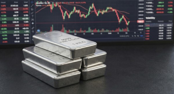 Stacked 99.99% fine silver bars are displayed in front of a digital financial chart, symbolising precious metals trading, market fluctuations, and silver as a safe-haven investment asset, AI generated