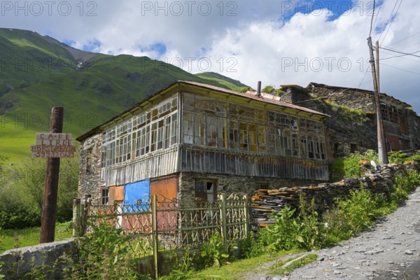 Rustic house on a mountainside under a cloudy sky, traditional house, Ushguli, Shibiani district, Zhibiani, Upper Svaneti, Svaneti, Georgia
