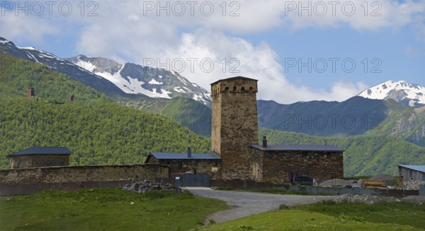 Wehrturm in the mountains against cloudy sky, Lamaria Church, Ushguli, Ushguli, Upper Svaneti, Svaneti, Georgia