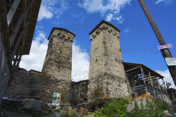 Two old stone towers under a cloudy sky, defensive towers, Ushguli, Ushguli, Shibiani district, Zhibiani, Upper Svaneti, Svaneti, Georgia