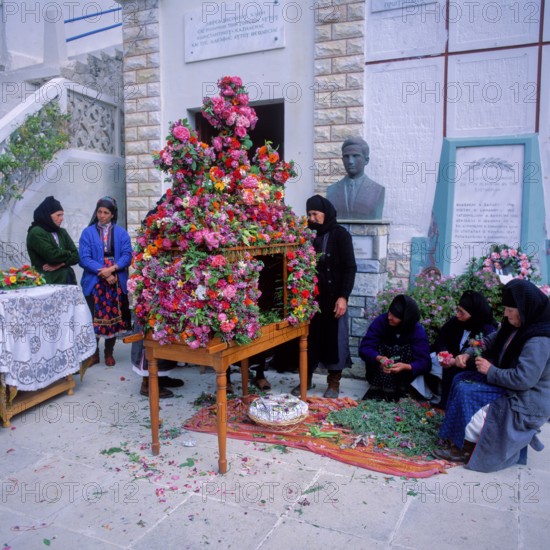 Good Friday, woman decorate the epitaph, Olymbos mountain village, Olymbos, Karpathos, Dodecanese Islands, Greece
