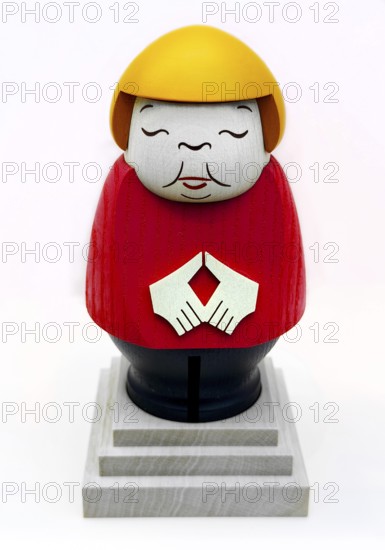 An avenger figure from the Ore Mountains depicts former federal chancellor Angela Merkel in black and red gold, House of History, Bonn, Germany