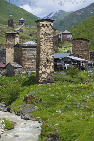 Mountain village with old stone towers on a river, nestled in a green alpine environment, defensive towers, Ushguli, Chazashi district, Chazhashi, Enguri river, Mingrelia and Upper Svaneti region, Svaneti, Georgia