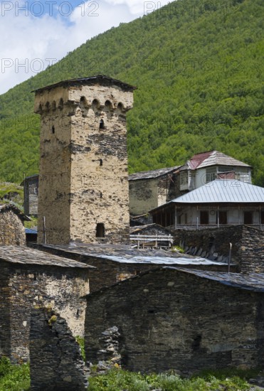 Historic stone building with a high tower in a green mountain valley, defensive towers, Ushguli, Ushguli, Chazhashi district, Mingrelia region and Upper Svaneti, Svaneti, Georgia