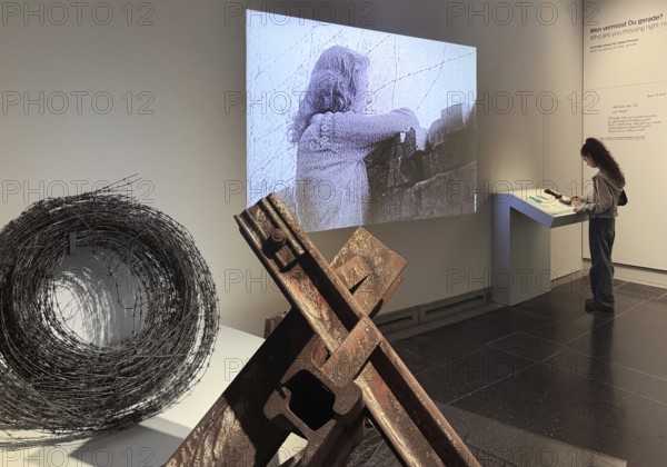 Construction of the Wall as a presentation in the House of History with original material and contemporary film with a young visitor, Bonn, North Rhine-Westphalia, Germany