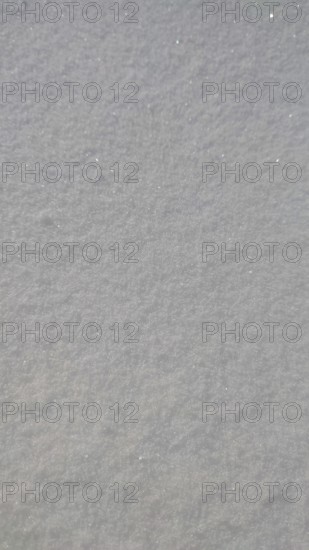 Close-up view of sparkling fresh snow covering a smooth surface, Franconian Forest