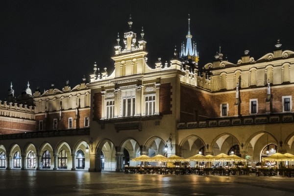 Night view of Rynek with Cloth Hall, from 13th century, Main Market Square, city landmark, Krakow, Poland