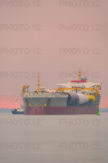 A semi-submersible ship is towed from the Weser to the North Sea, Bremerhaven, Bremen, Germany