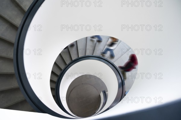 Spiral staircase with descending persons, Bavaria, Germany