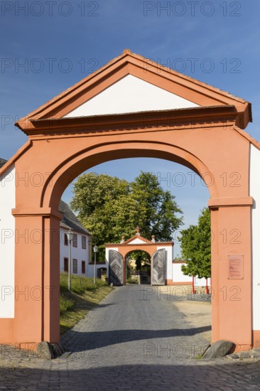 View through 2 gates at the entrance to St. Marienthal Abbey on the Neisse, Ostritz, Saxony, Germany