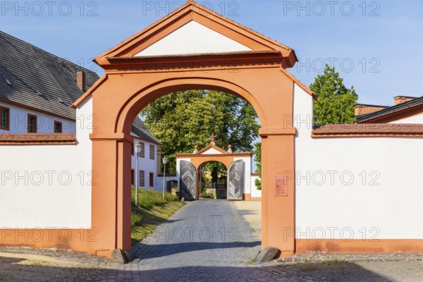 View through 2 gates at the entrance to St. Marienthal Abbey on the Neisse, Ostritz, Saxony, Germany