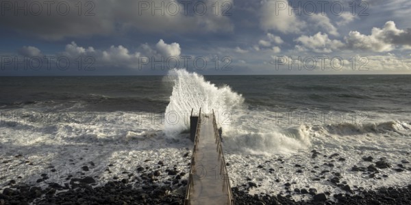 Pier during storm, bridge with waves, Atlantic Ocean, Madeira, Portugal