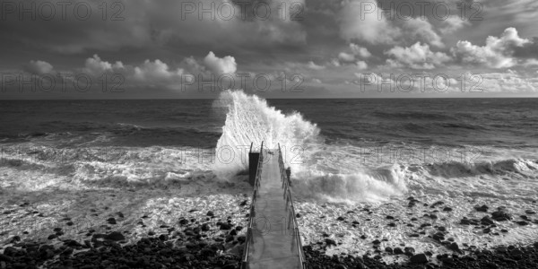 Pier during storm, bridge with waves, Atlantic Ocean, Madeira, Portugal