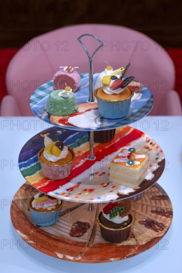 Artificial cupcakes on a cake stand, England, Great Britain