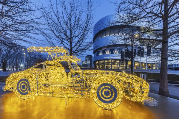 The Mercedes-Benz Museum in Stuttgart presents a journey through the automotive history of the global corporation. 160 vehicles are shown. At Christmas time, there is a light installation in front of the building. It represents the iconic classic Mercedes SL car. Night shot. Stuttgart, Baden-Württemberg, Germany