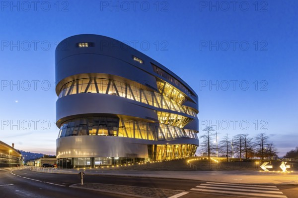 The Mercedes-Benz Museum in Stuttgart presents a journey through the automotive history of the global corporation. Spectacular architecture of the Automobile Museum in the evening. Stuttgart, Baden-Württemberg, Germany