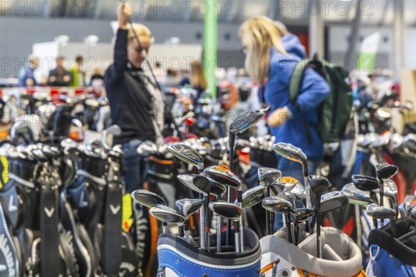 Presentation of golf clubs. Caravan — Motor — Tourism trade fair in Stuttgart. Stuttgart, Baden-Württemberg, Germany