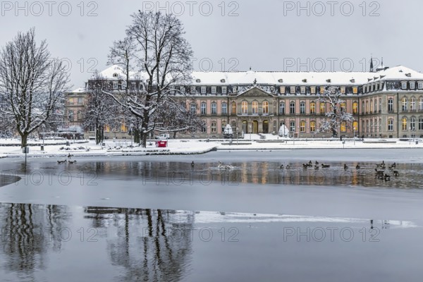 New castle with Eckensee. Winter in Stuttgart. The city is wintry white early in the morning. Stuttgart, Baden-Württemberg, Germany