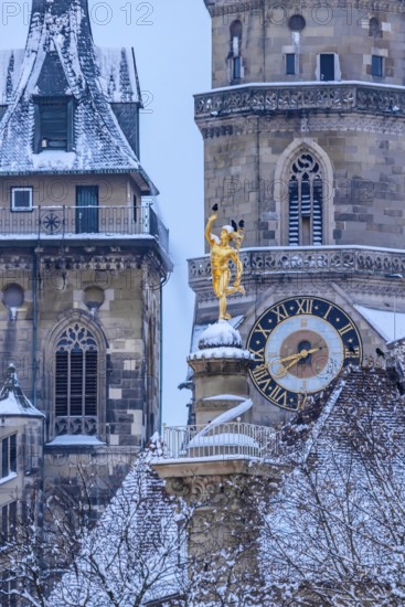 Winter in Stuttgart. The city is wintry white early in the morning. Collegiate church with Mercury's Column. Stuttgart, Baden-Württemberg, Germany