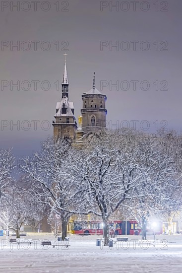 Winter in Stuttgart. The city is wintry white early in the morning. Castle square with collegiate church. Stuttgart, Baden-Württemberg, Germany