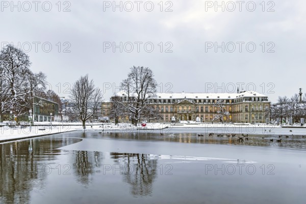 Winter in Stuttgart. It snowed overnight and the city is wintry white early in the morning. New castle with Eckensee. Stuttgart, Baden-Württemberg, Germany