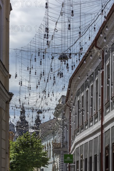 Light bulbs for evening lighting between houses, Cluj-Napoca, Romania