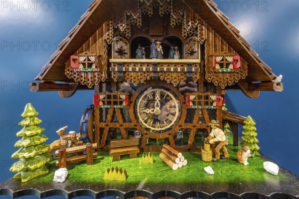 Cuckoo clock, exhibited at the CMT exhibition. This handcrafted watch is typical of the Black Forest. Stuttgart, Baden-Württemberg, Germany