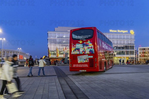 Stuttgart City Tour. Red double-decker for sightseeing tours at Messe Stuttgart. Stuttgart, Baden-Württemberg, Germany