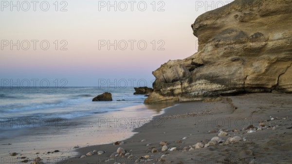 Sunrise on the coast near Mirbat, Oman