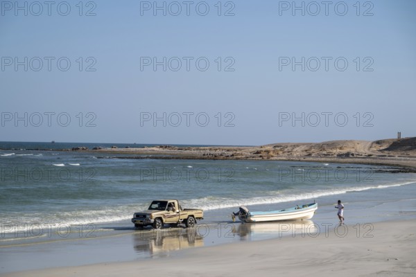 Car pulls fishing boat into sea, Oman