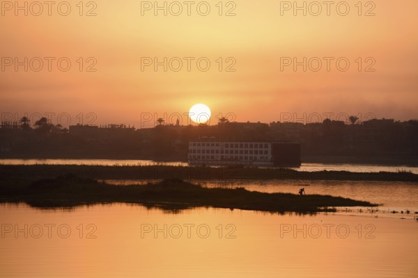 Nile cruise ship at sunset on the Nile, Luxor, Egypt