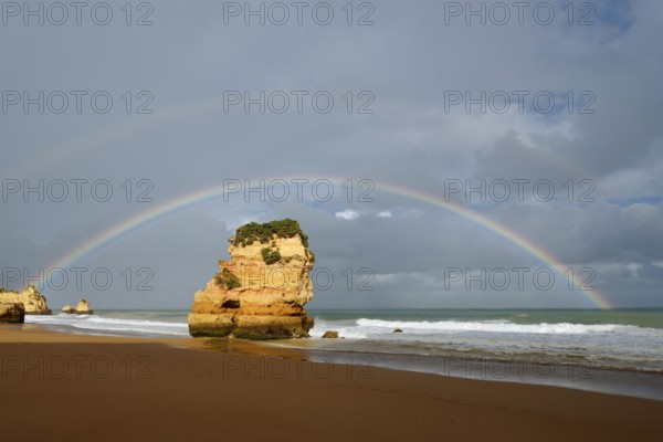 Rocks on beach with rainbow, Praia Dona Ana, Lagos, Algarve, Portugal