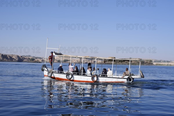 Sightseeing boat with tourists on Lake Nasser, Aswan, Egypt