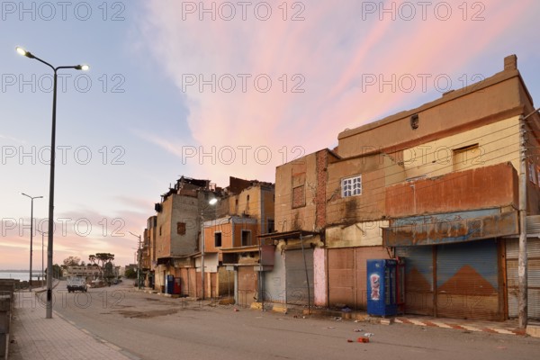 Street and houses on the Nile at dawn, Esna, Egypt
