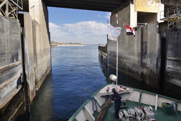 Nile cruise ship leaves the lock at the Esna dam, Esna, Egypt