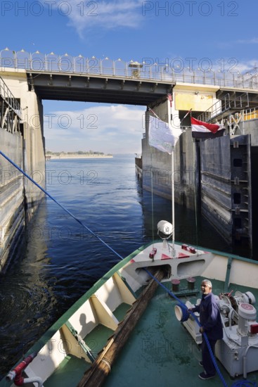 Nile cruise ship leaves the lock at the Esna dam, Esna, Egypt