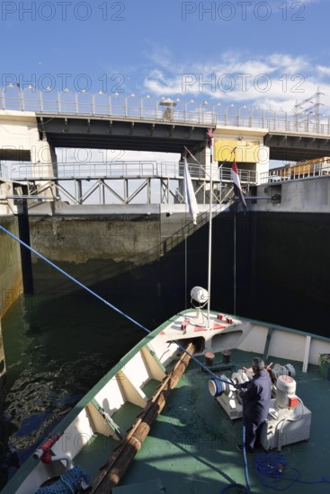 Nile cruise ship enters the lock at the Esna dam, Esna, Egypt