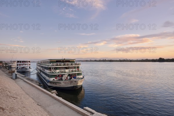 Nile cruise ships at sunrise at the pier in Esna, Egypt