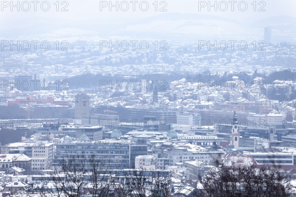 March 18, 2018, winter view with snow toward city center with station and tower from Mount Scherbelino, Stuttgart, Baden-Württemberg, Germany