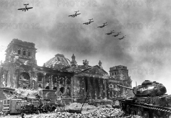 Soviet aircraft over the Berlin Reichstag, Mitte, Berlin in April 1945. J. Chaldej used two assembly techniques in this picture. The aircraft were illuminated using a negative mount. The tank was cut out and glued to the picture. Chaldej about this photo: When this photo appeared in Pravda, I received a letter from a pilot. He wrote: “Dear correspondent, I remember the day when we bombed the Reichstag. My plane is that on the edge. '
