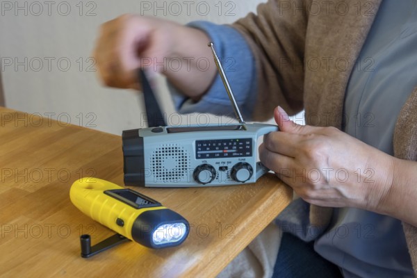 Emergency equipment, flashlight and radio with crank operation, by turning the crank we generate electricity in a dynamo, which charges a battery in the flashlight, radio, in addition a small solar module to generate electricity from sunlight, for emergency preparedness in the event of a power failure, blackout, energy supply