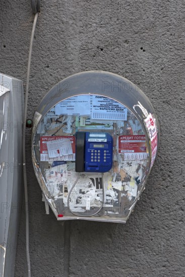 Public telephone on a house wall, Drochobych, Ukraine
